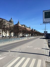 Buildings against clear blue sky