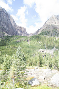 Scenic view of mountains against cloudy sky