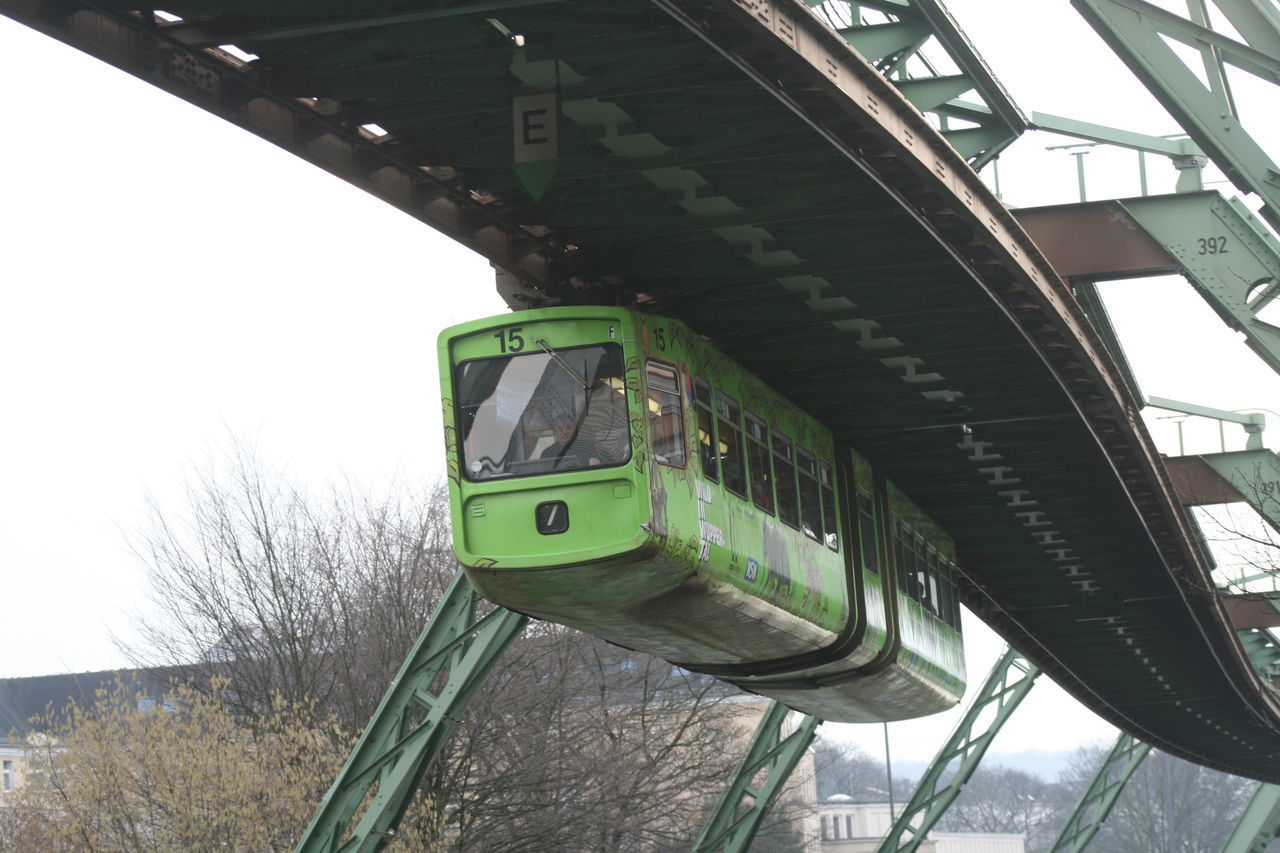 LOW ANGLE VIEW OF BRIDGE AGAINST TREES