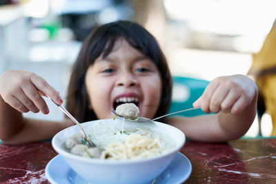 Close-up of man eating food