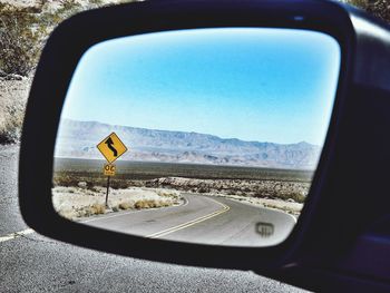 View of mountain road against cloudy sky