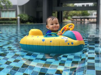 Portrait of smiling boy in swimming pool