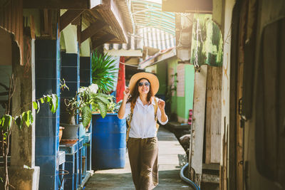 Full length portrait of woman standing