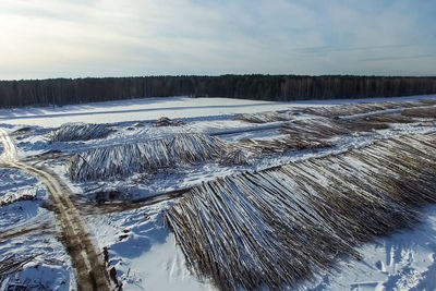 Panoramic shot of frozen land against sky