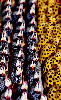 Full frame shot of toy hens and giraffes at market