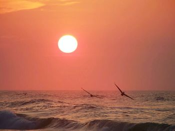 Scenic view of sea at sunset