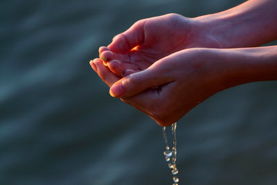 Close-up of hand holding water