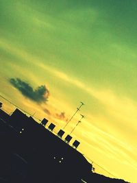 Low angle view of building against sky at sunset