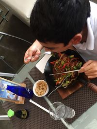 High angle view of man using mobile phone