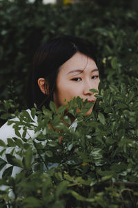 Portrait of young woman looking away