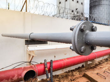 Close-up of pipes against wall