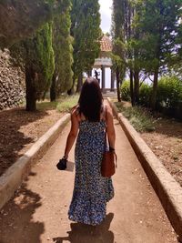 Rear view of woman walking in park