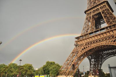 Low angle view of rainbow over city