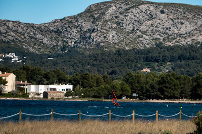 Scenic view of sea against mountains