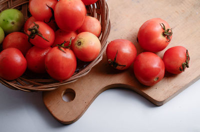 High angle view of tomatoes in basket on table