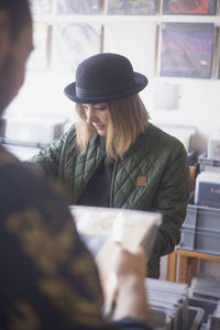 Young woman shopping for records