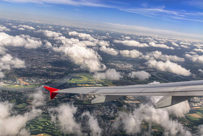 Aerial view of airplane flying in sky