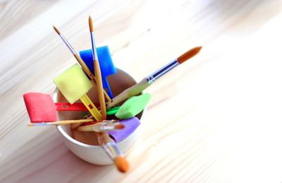 Close-up of multi colored pencils on table