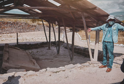 Rear view of man working at beach