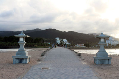 Built structure on beach against sky