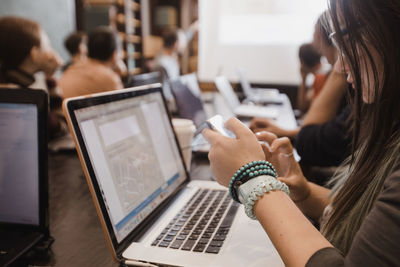 Students in classroom working with laptops