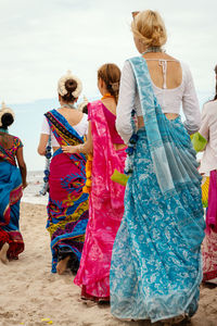 Rear view of people in traditional clothing