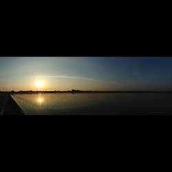 Scenic view of sea at sunset