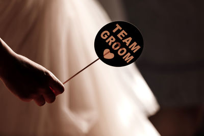 Text sign showing groom team. bride and her bridesmaid holding accessories for the wedding photo 