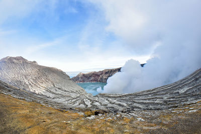 Scenic view of volcanic mountain against sky