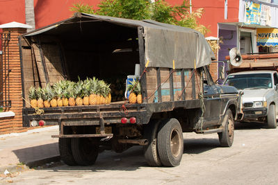 Stack of truck on street in city