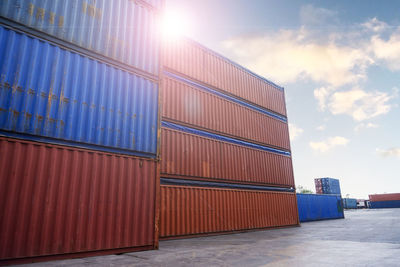 Stack of pier at harbor against sky