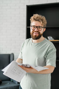 Portrait of young man using mobile phone