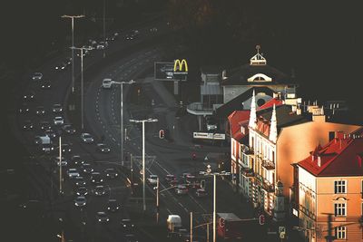 High angle view of illuminated street and buildings at night