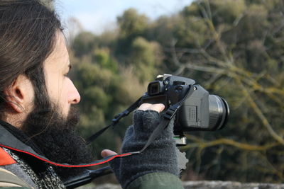 Close-up of man photographing