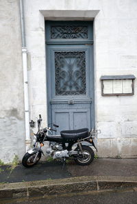 Bicycles on street against building