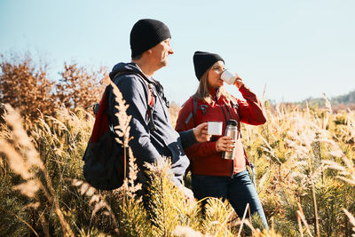 Couple relaxing and enjoying the coffee during vacation trip. active leisure time close to nature