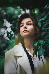 Low angle view of woman by tree