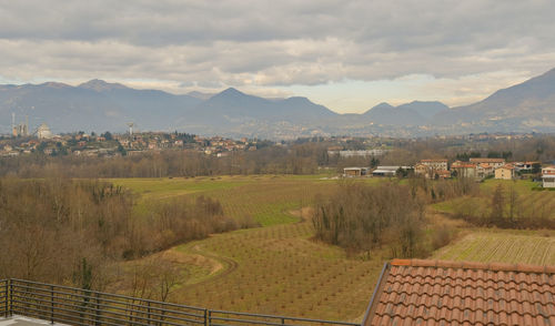 Scenic view of landscape and mountains against sky