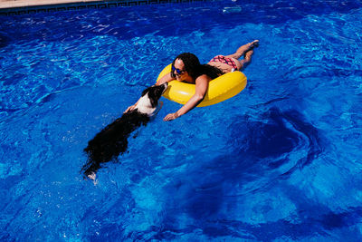 High angle view of woman swimming in pool