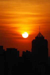 Silhouette of buildings at sunset