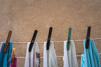Close-up of laundry and clothespins on clothesline