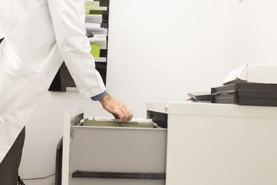 Low angle view of woman working on table