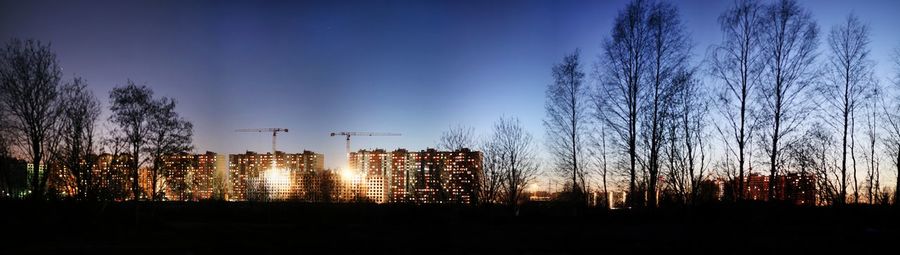 Panoramic view of buildings against sky at night