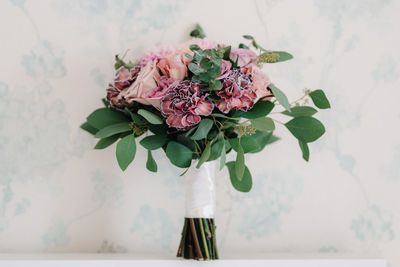 Close-up of bouquet in vase on table