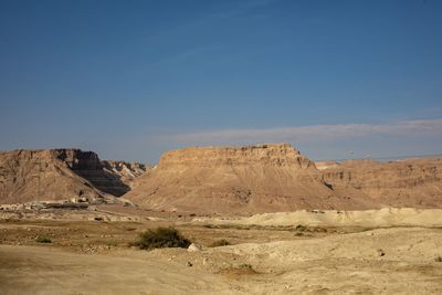 Rock formations in desert against sky