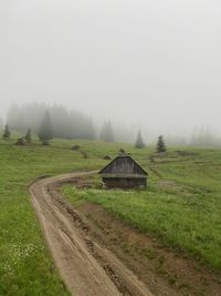 House on field against sky