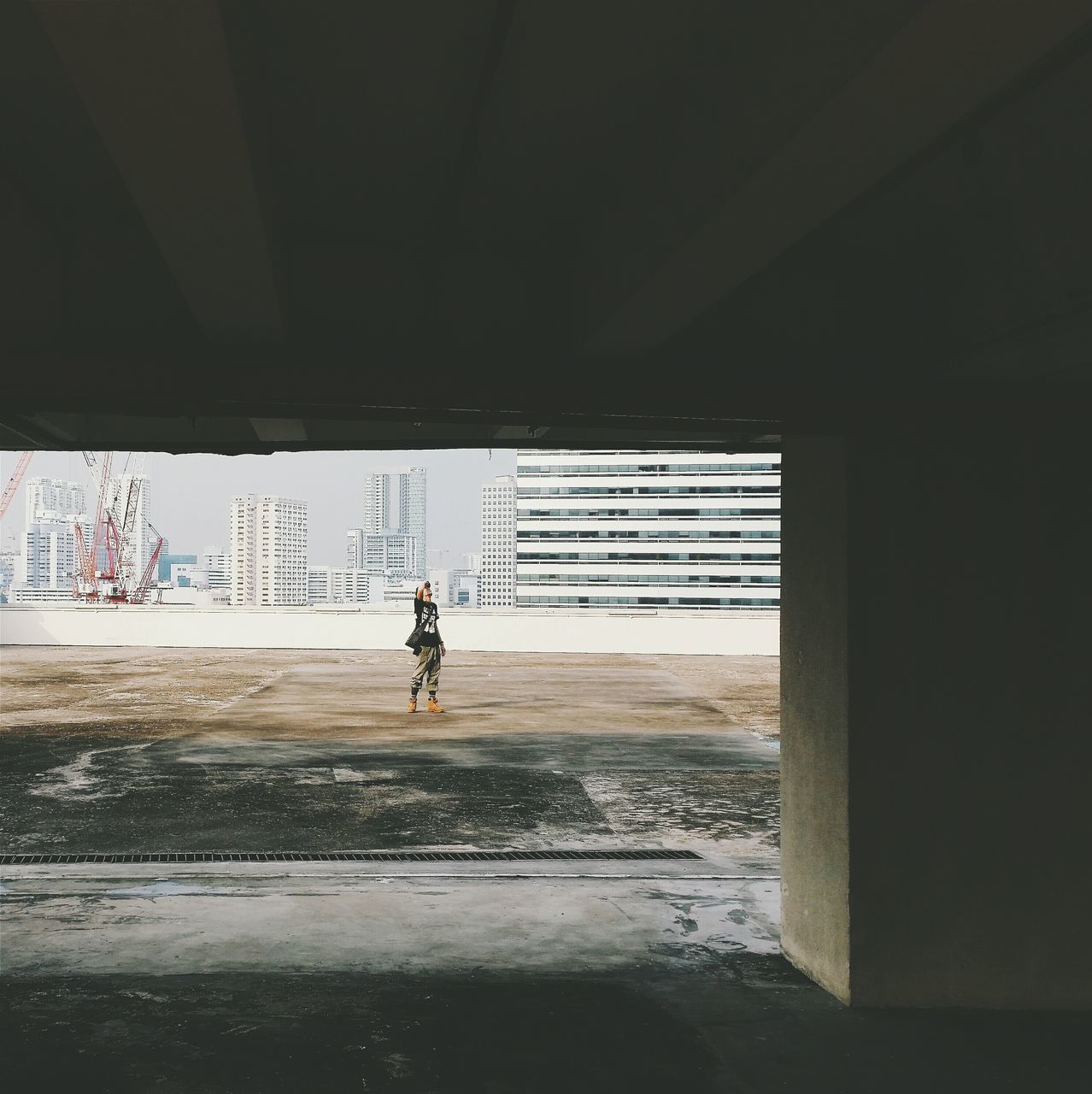 built structure, architecture, indoors, water, wall - building feature, street, full length, lifestyles, sunlight, window, graffiti, motion, shadow, day, road, silhouette, men