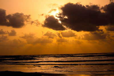 Scenic view of sea against sky at sunset