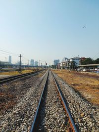 Railroad tracks against clear sky