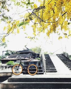 Bicycle against sky in city